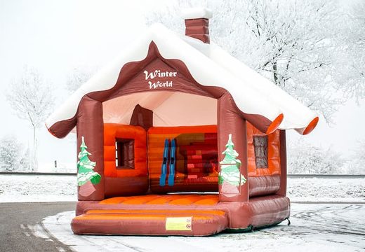 Skihut winterworld bounce house with a 3D chimney at the top for children. Order inflatable bounce houses online at JB Inflatables America