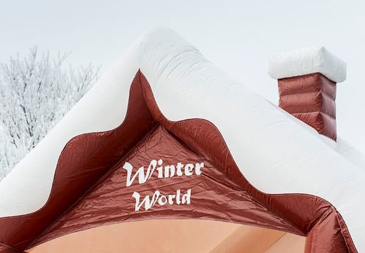 Skihut winterworld bounce house with a 3D chimney at the top for children. Bounce houses for sale online at JB Inflatables America