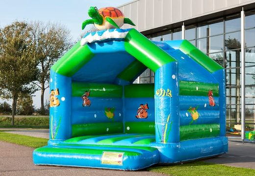 Buy unique standard bounce houses with a 3D turtle object on the top for kids. Buy bounce houses online at JB Inflatables America