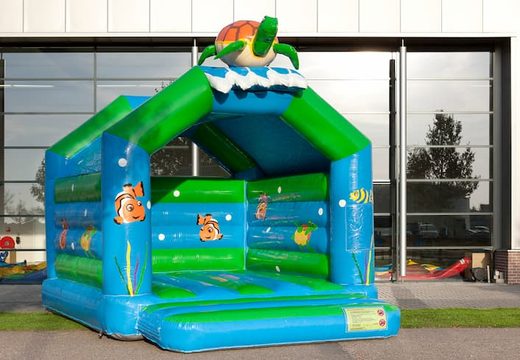 Buy standard bounce houses with a 3D object of a turtle on the top for children. Order bounce houses online at JB Inflatables America