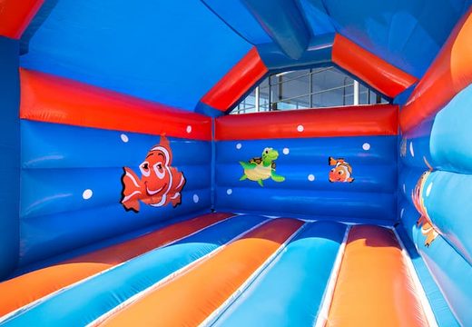 Buy standard party bounce houses in striking colors with a large 3D clownfish object on top for children. Buy bounce houses  online at JB Inflatables America