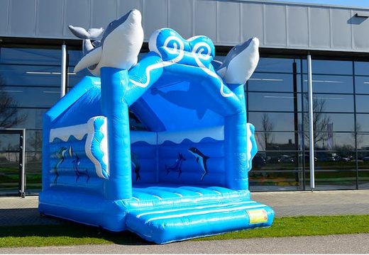 Buy standard bouncy castles in striking colors with a 3D object in the shape of dolphins on the top for children. Buy bouncy castles online at JB Inflatables America