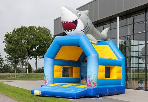 Buy standard bounce houses with a 3D object of a shark on the top for children. Order bounce houses online at JB Inflatables America