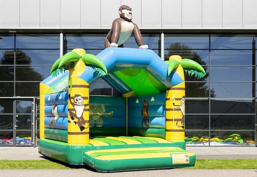 Standard jungle bounce houses for sale in striking colors with a large gorilla 3D object on the top for children. Buy indoor bounce houses online at JB Inflatables America