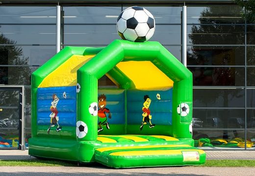 Order a standard bounce house in striking colors with a large 3D football object for children on top. Inflatable bounce houses for sale online at JB Inflatables America