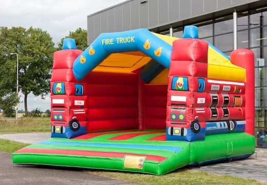 Super bounce house with roof in fire department theme for kids. Buy bounce houses online at JB Inflatables America