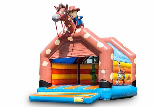Big inflatable bouncy castle with roof in cowboy theme to buy for kids. Order bouncy castles online at JB Inflatables America 