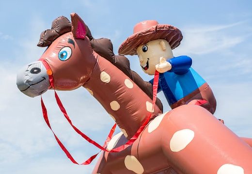 Buy a large indoor bounce house in a cowboy theme for kids. Order bounce houses online at JB Inflatables America 