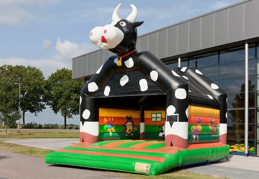 Buy cow super bounce house with cheerful animations for kids. Buy bounce houses online at JB Inflatables America 
