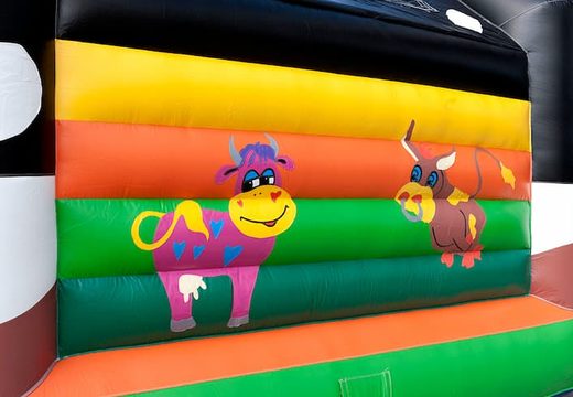 Buy super bounce house with roof in cow theme for kids. Order bounce houses online at JB Inflatables America
