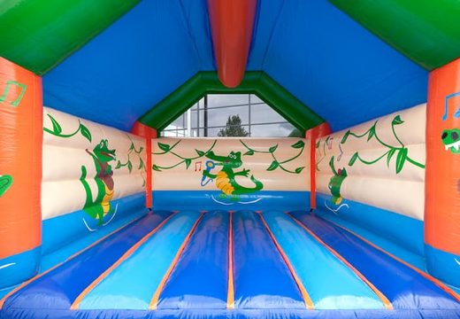 Big super bouncer covered with cheerful animations in crocodile theme for children. Order bouncers online at JB Inflatables America 