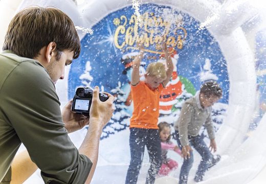 Buy an inflatable airtight snow globe XL for both young and old. Order inflatable winter attractions now online at JB Inflatables America