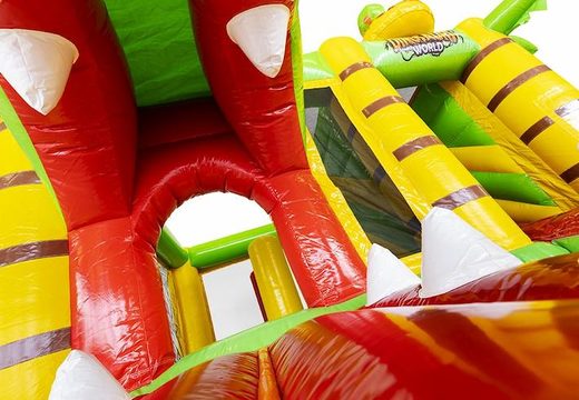 Buy a compact inflatable air cushion with slide in a Dino theme for children