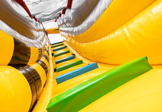 Buy large inflatable double slide in red and yellow for children to play on