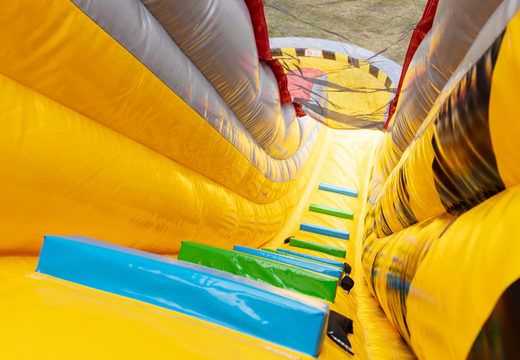 Large inflatable double slide in red and yellow for children to play on for sale