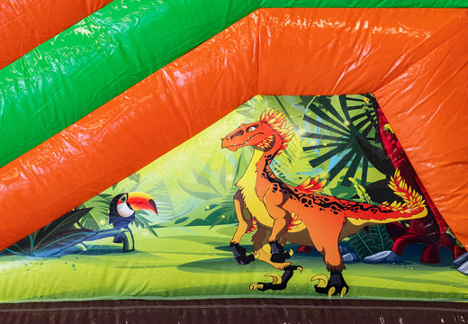 Order inflatable Multiplay bouncy castle with slide in theme Dinoworld for children. Buy inflatable bouncy castles online at JB Inflatables America