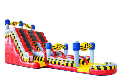 Striking bouncy castle with slide in red, black, yellow and blue