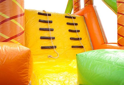 Climbing wall on jungle theme bouncy castle