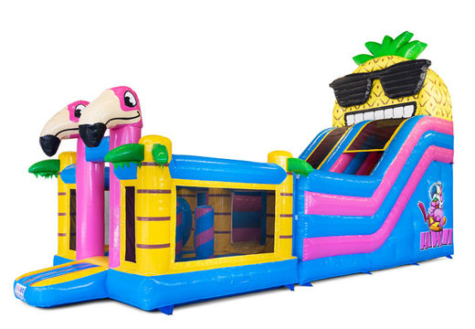 Mega bouncy castle with slide in a tropical theme for the summer